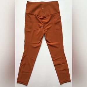 Athleta Salutation stash pocket ii 7/8 length leggings size Small - orange